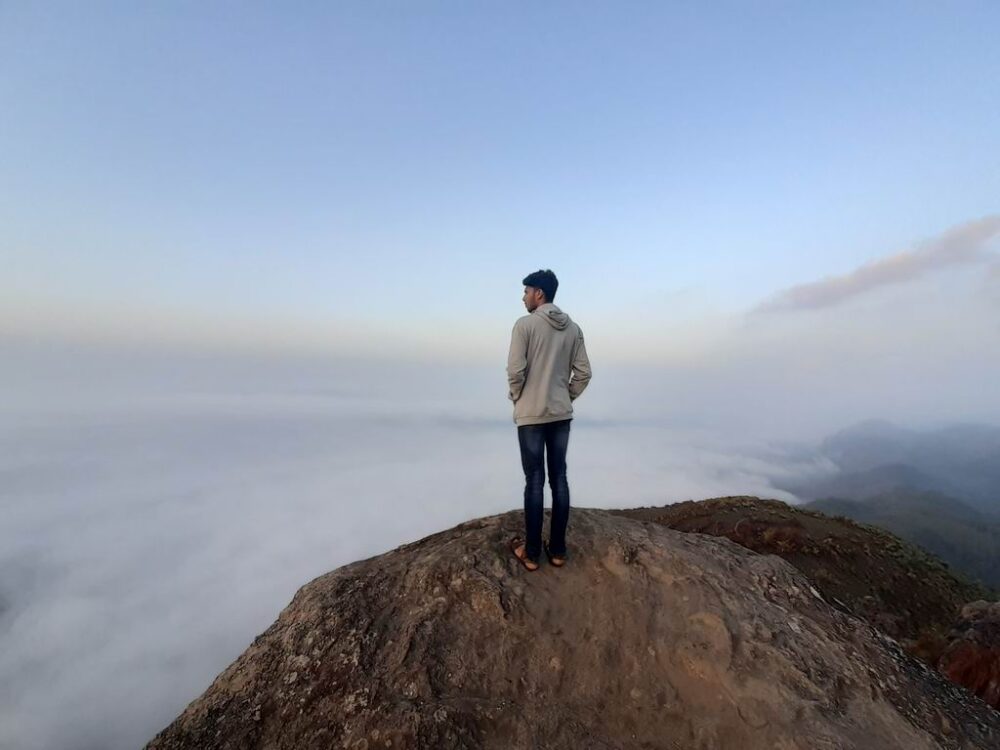 Misty sunrise view from Pettimudi Hill Top Adimali3