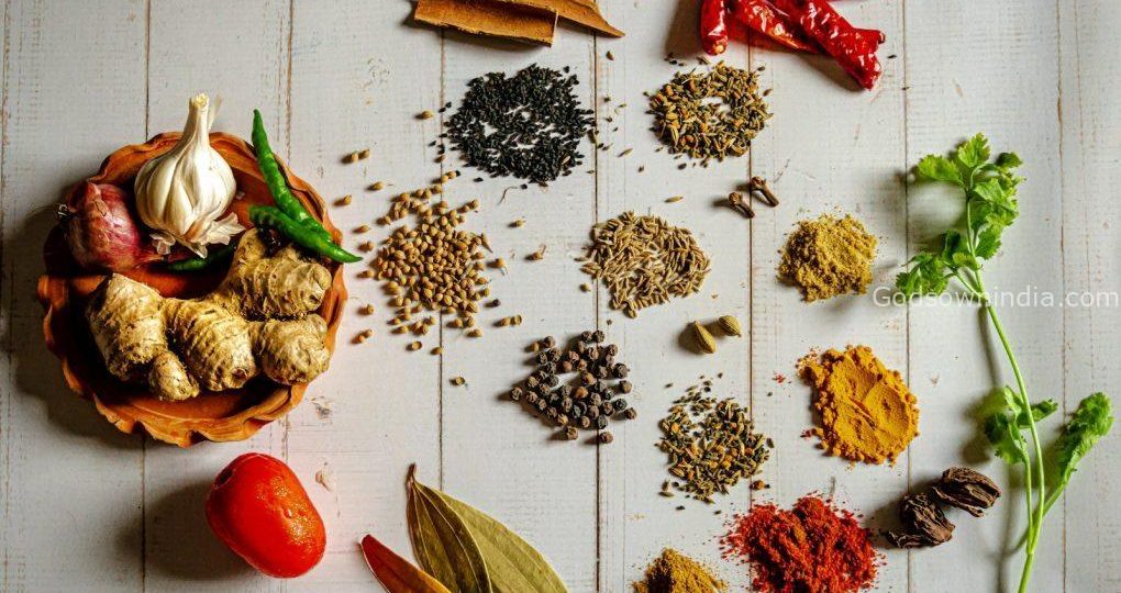 a variety of spices on a white table