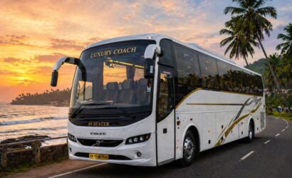 A 49-seater luxury coach parked near a scenic coastal road