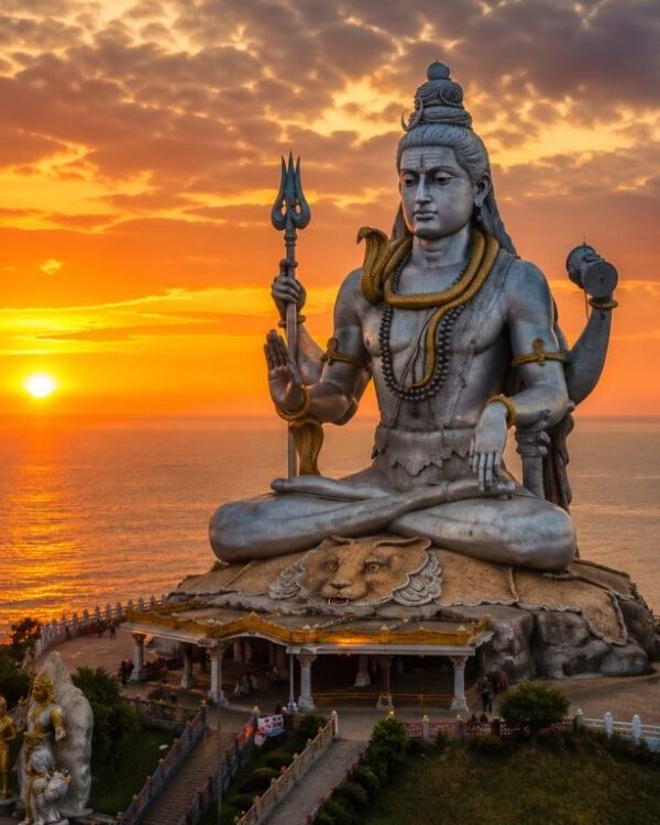 The colossal Lord Shiva Statue at Murudeshwar against the sunset.