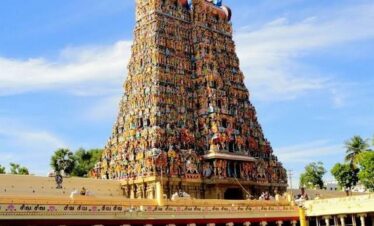 The Meenakshi Amman Temple. The towering, colorful Gopurams covered in thousands of stone figures are the signature look of Madurai.
