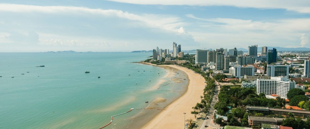 aerial view of city buildings near sea during daytime