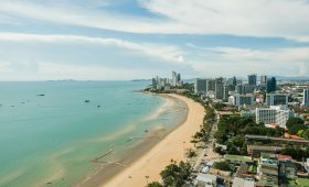aerial view of city buildings near sea during daytime