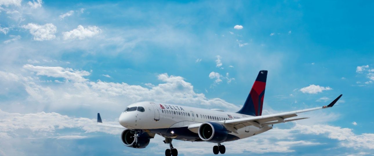 white passenger plane under blue sky during daytime